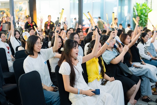 A group of people sitting in chairs holding toy gunsAI-generated content may be incorrect.